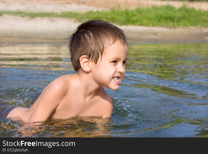 Portrait of the boy in the river