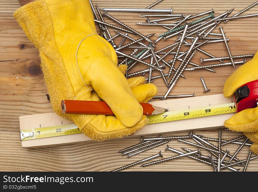 The worker makes a marking in meter