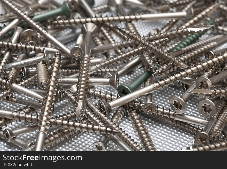 Background with metal screws. tools