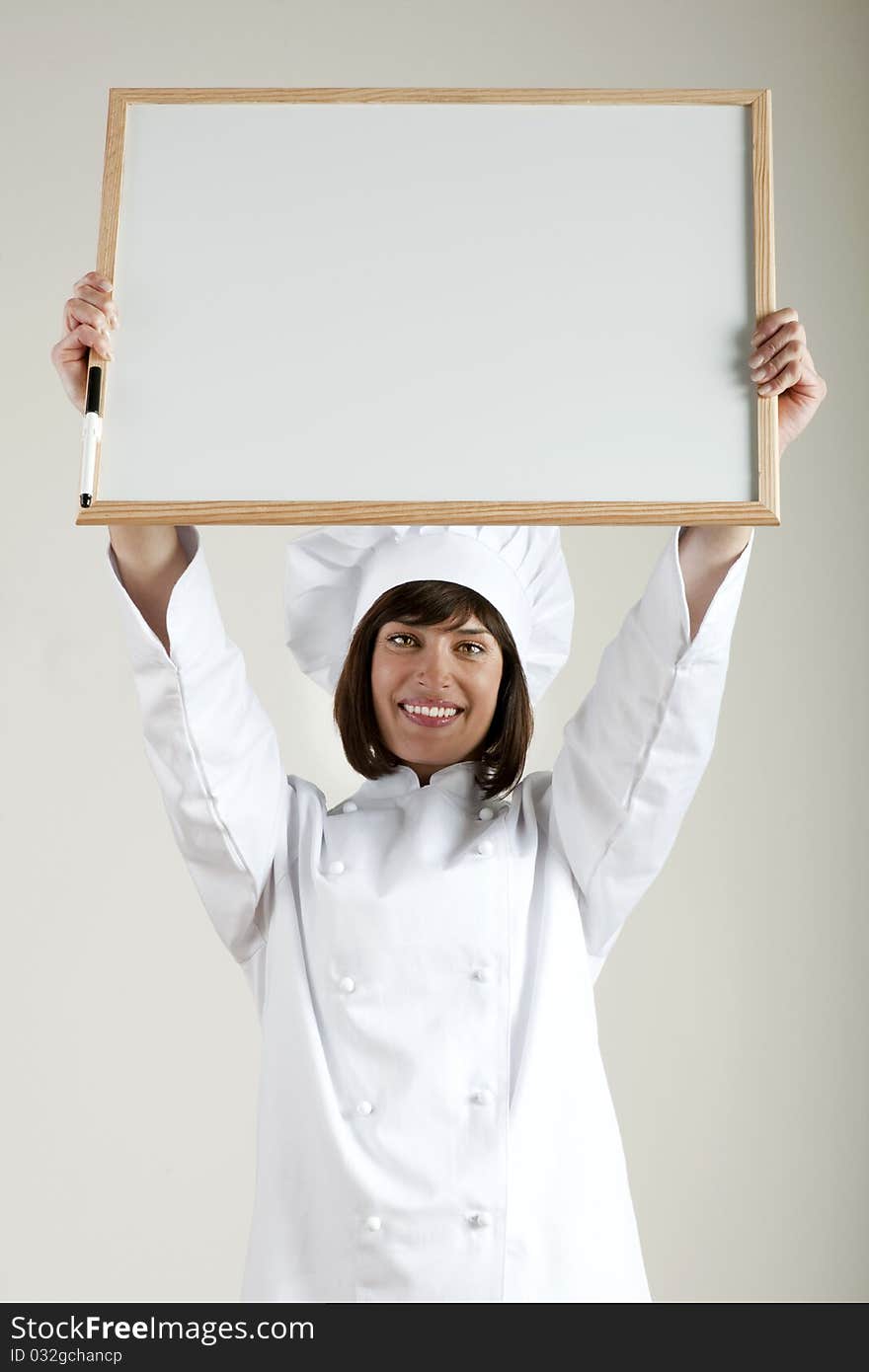 Beautiful female Chef with Blackboard. Beautiful female Chef with Blackboard