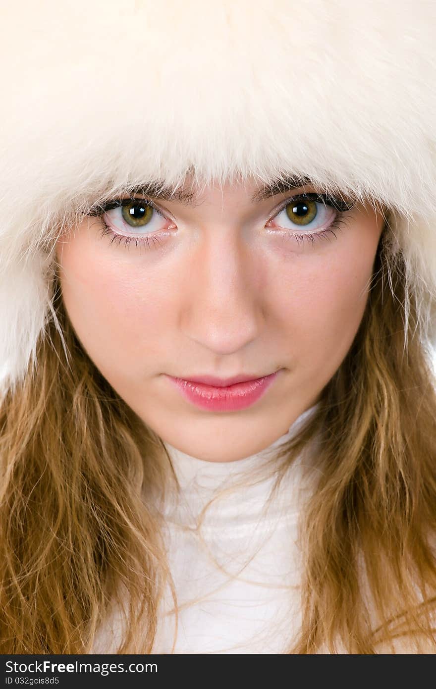 Portrait of young woman in fur cap. Portrait of young woman in fur cap