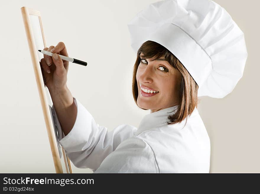 Beautiful female Chef with Blackboard. Beautiful female Chef with Blackboard