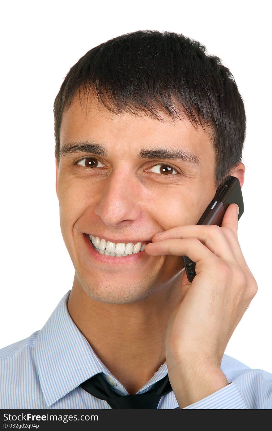 Closeup portrait of a happy young man speaking on the cellphone. Closeup portrait of a happy young man speaking on the cellphone