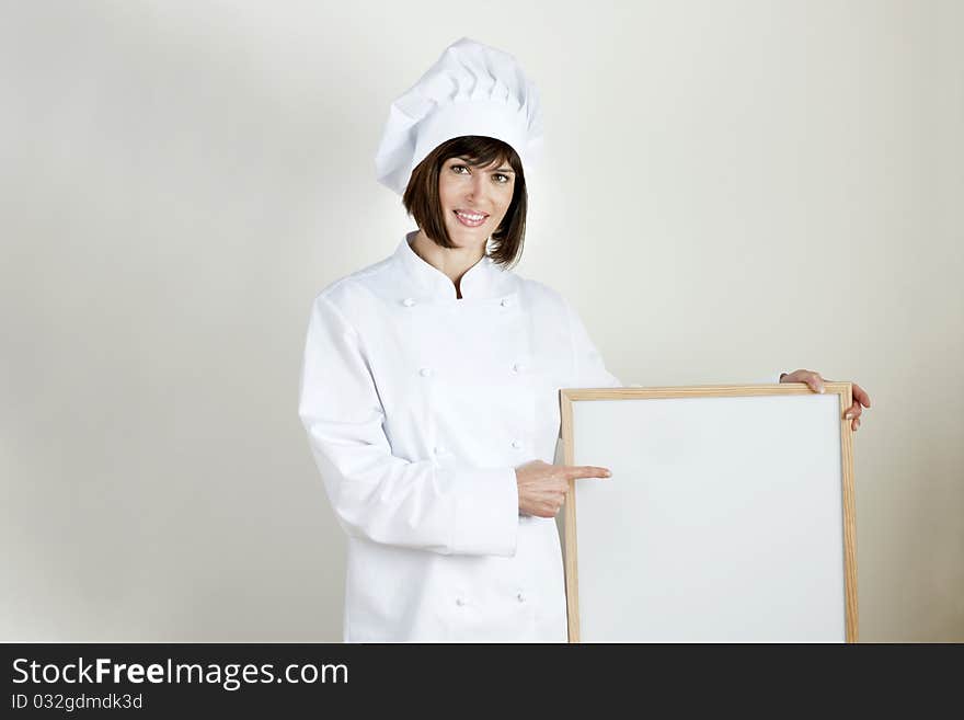 Beautiful female Chef with Blackboard. Beautiful female Chef with Blackboard