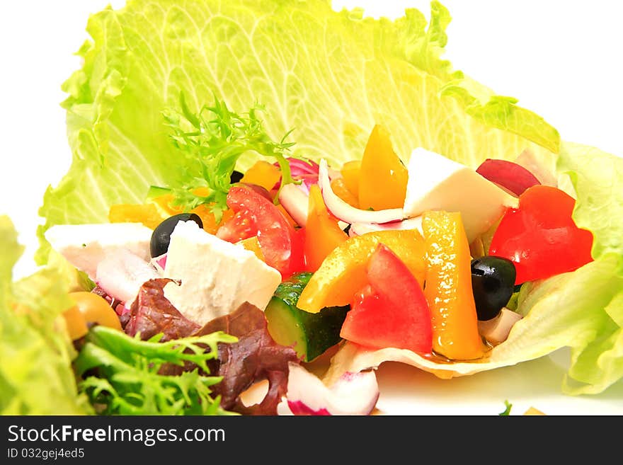 Vegetarian salad with fresh vegetables on a ceramic platter