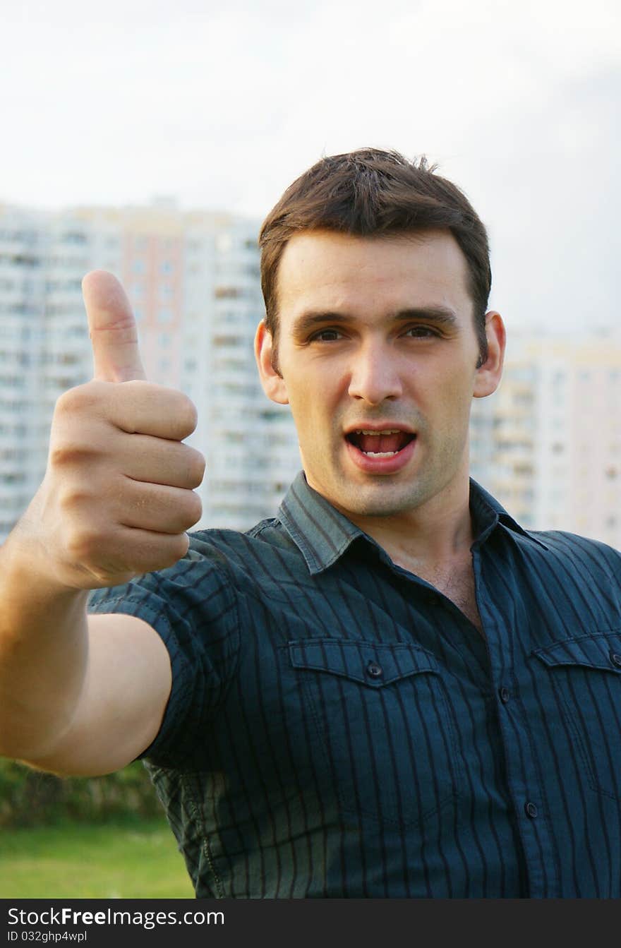 Сasual man showing thumb up