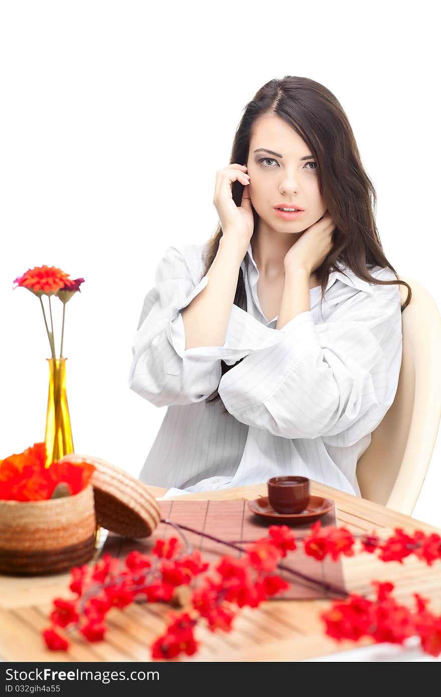 Woman dirinking tea smiling and looking at camera wearing formal clothes. Woman dirinking tea smiling and looking at camera wearing formal clothes