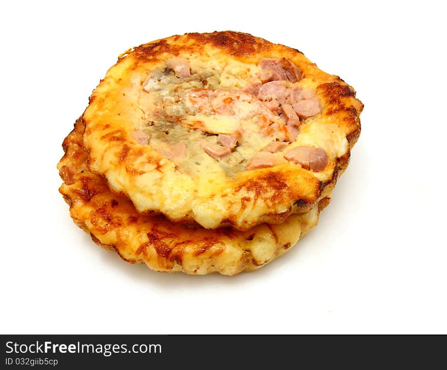 Small pizza and Italian cuisine. On a white background. Small pizza and Italian cuisine. On a white background