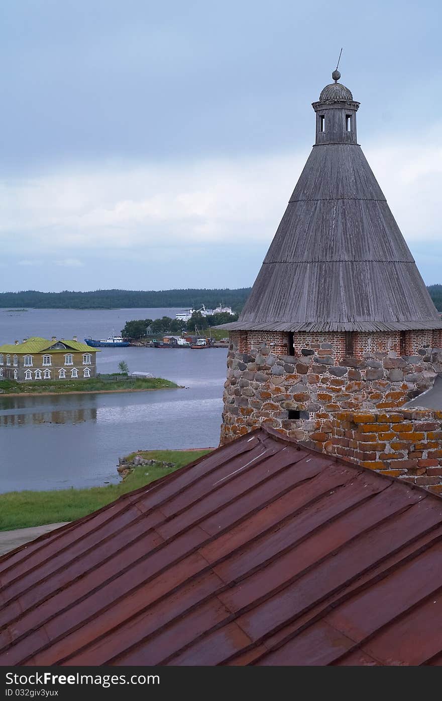 Old round stone tower in Solovetsky monastery with blue sky background, Karelia, Russian Federation. Old round stone tower in Solovetsky monastery with blue sky background, Karelia, Russian Federation.