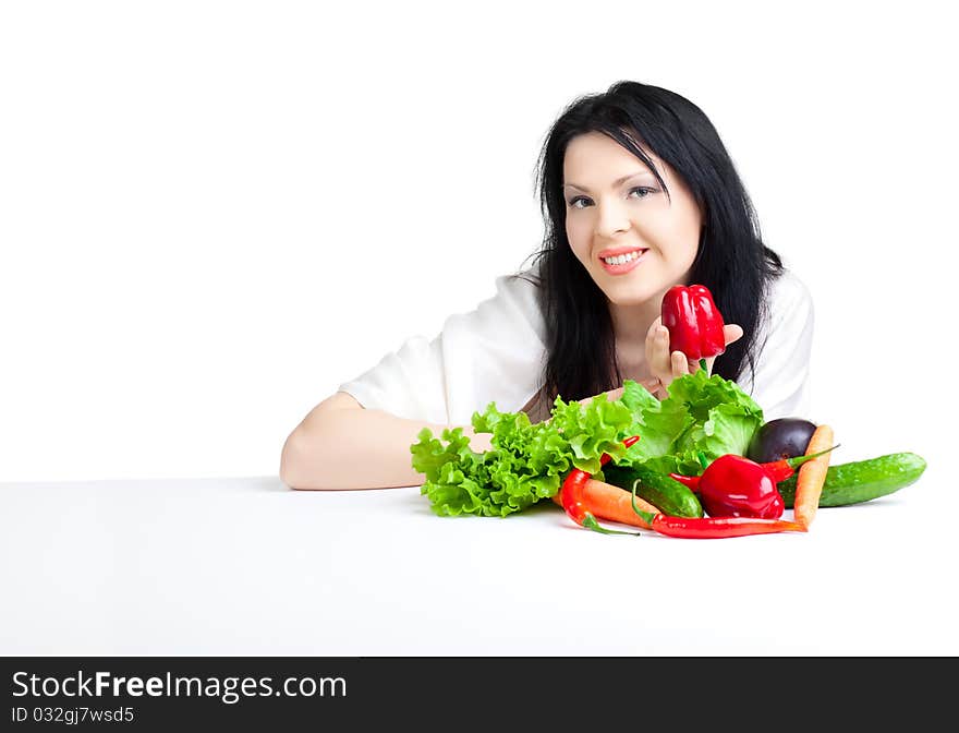 Beautiful woman with vegetables over white background. Beautiful woman with vegetables over white background