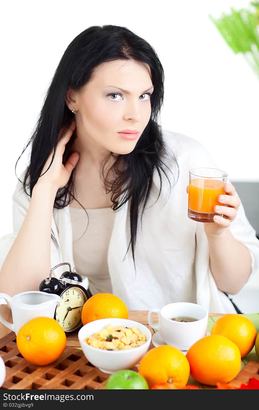 Woman dirinking tea smiling and looking at camera wearing formal clothes. Woman dirinking tea smiling and looking at camera wearing formal clothes