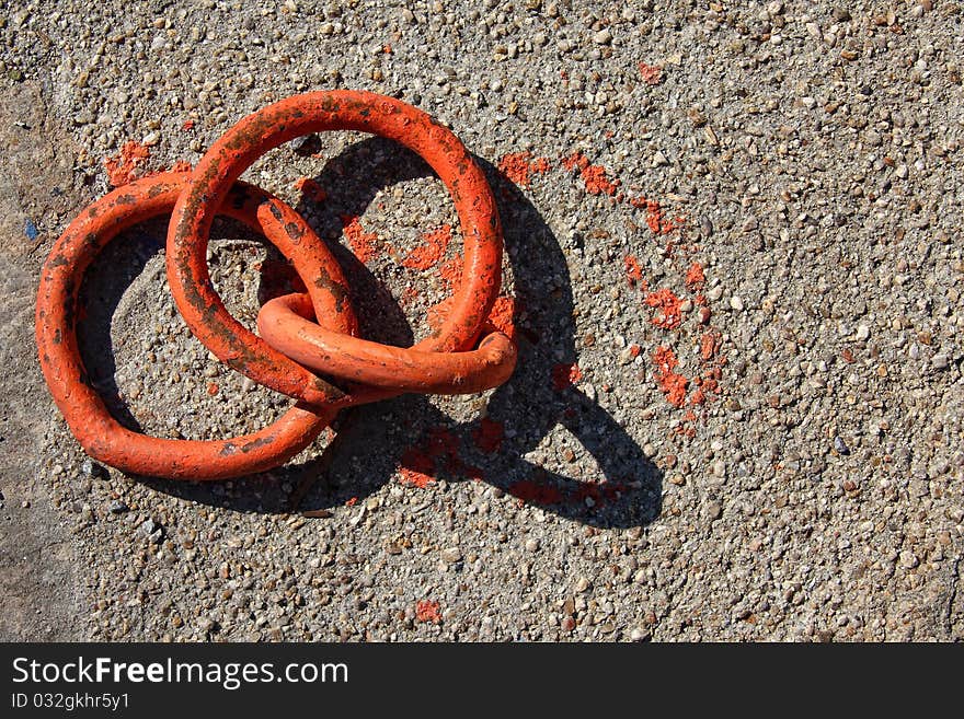 Orange boat hooks on marine concrete platform texture. Orange boat hooks on marine concrete platform texture