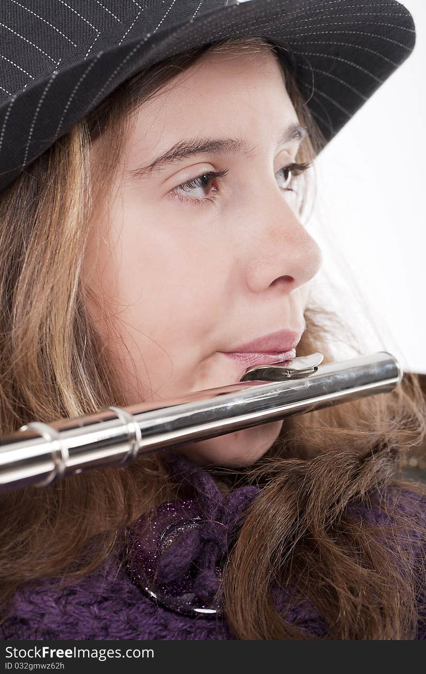 Young girl playing flute