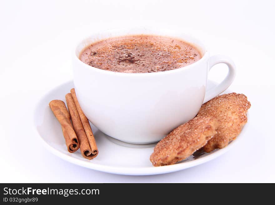 Cup of hot chocolate with cinnamon and cinnamon cookies on white background. Cup of hot chocolate with cinnamon and cinnamon cookies on white background