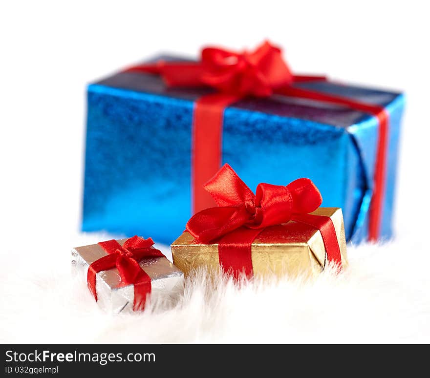 Small Gift Boxes Over A Big One Isolated On White