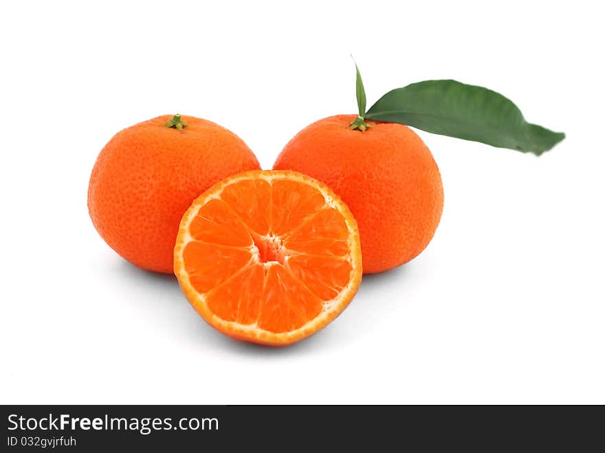 Tangerines with leaves on white background