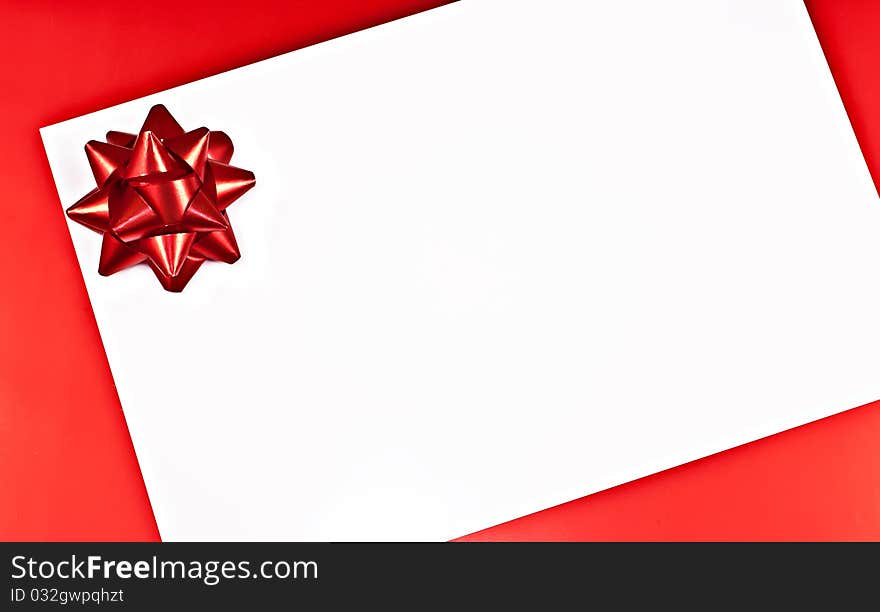 On a red background white greeting card with a red Bantu. On a red background white greeting card with a red Bantu.