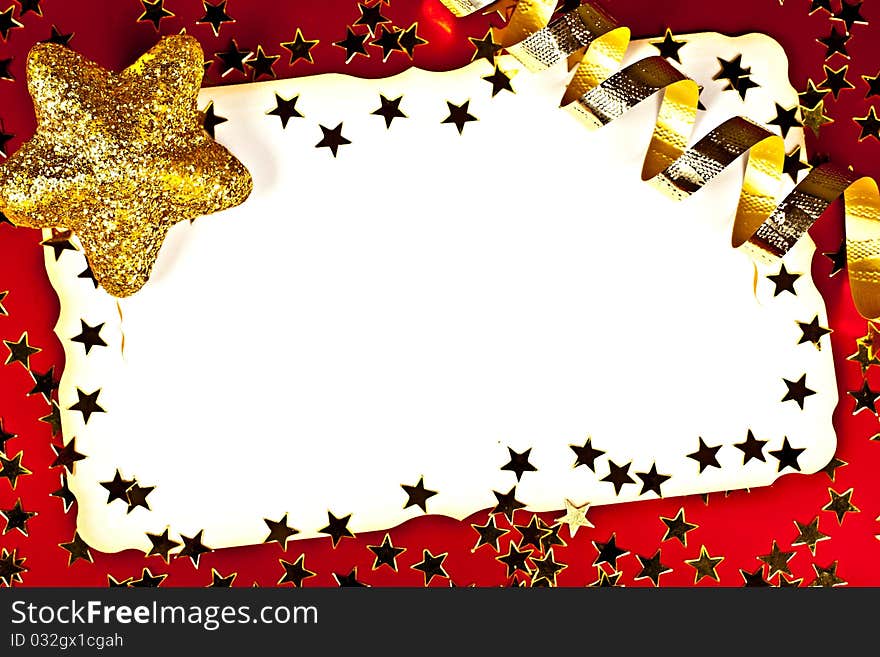 On a red background white greeting card with golden stars. On a red background white greeting card with golden stars.