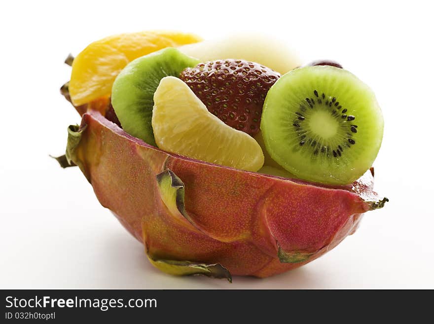 Fruit salad in a cuted pitahaya