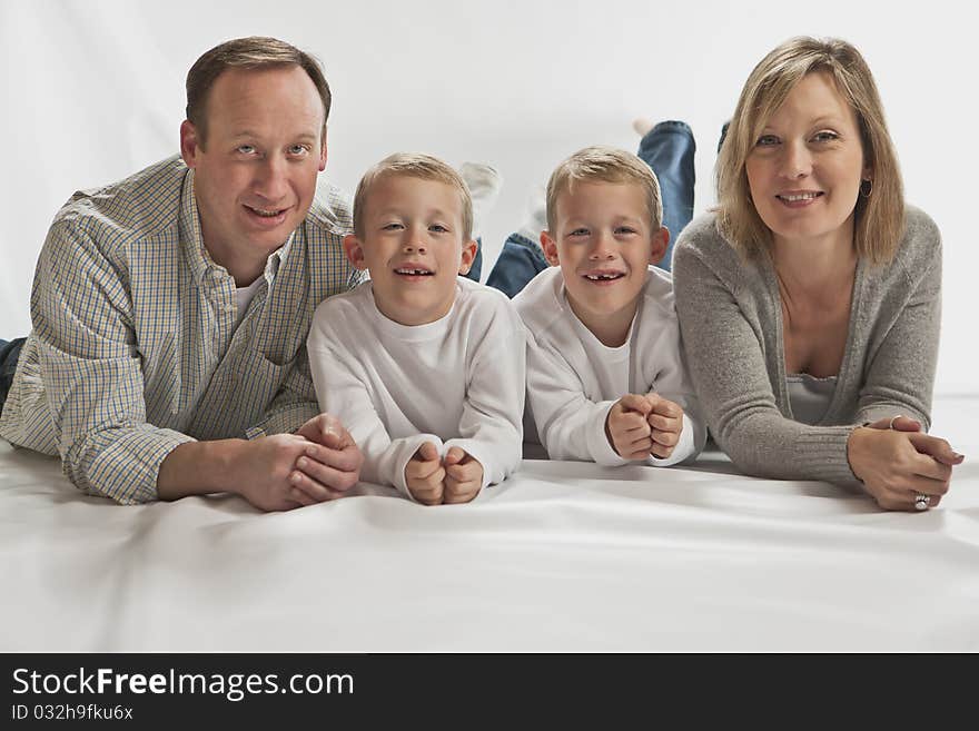 Young Happy Family With Two Identical Twins