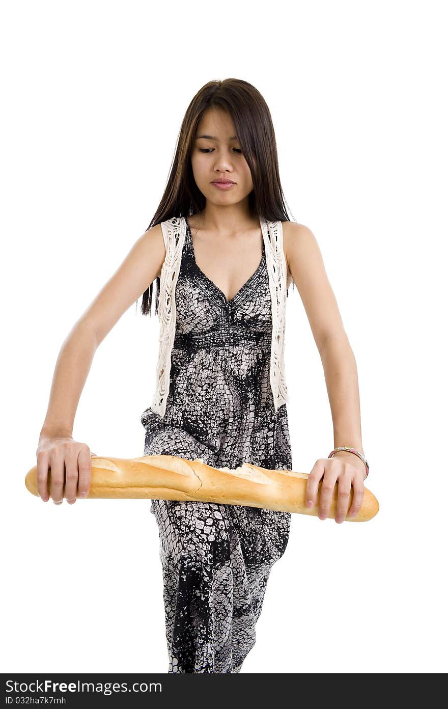 Pretty woman breaking a baguette, isolated on white background. Pretty woman breaking a baguette, isolated on white background