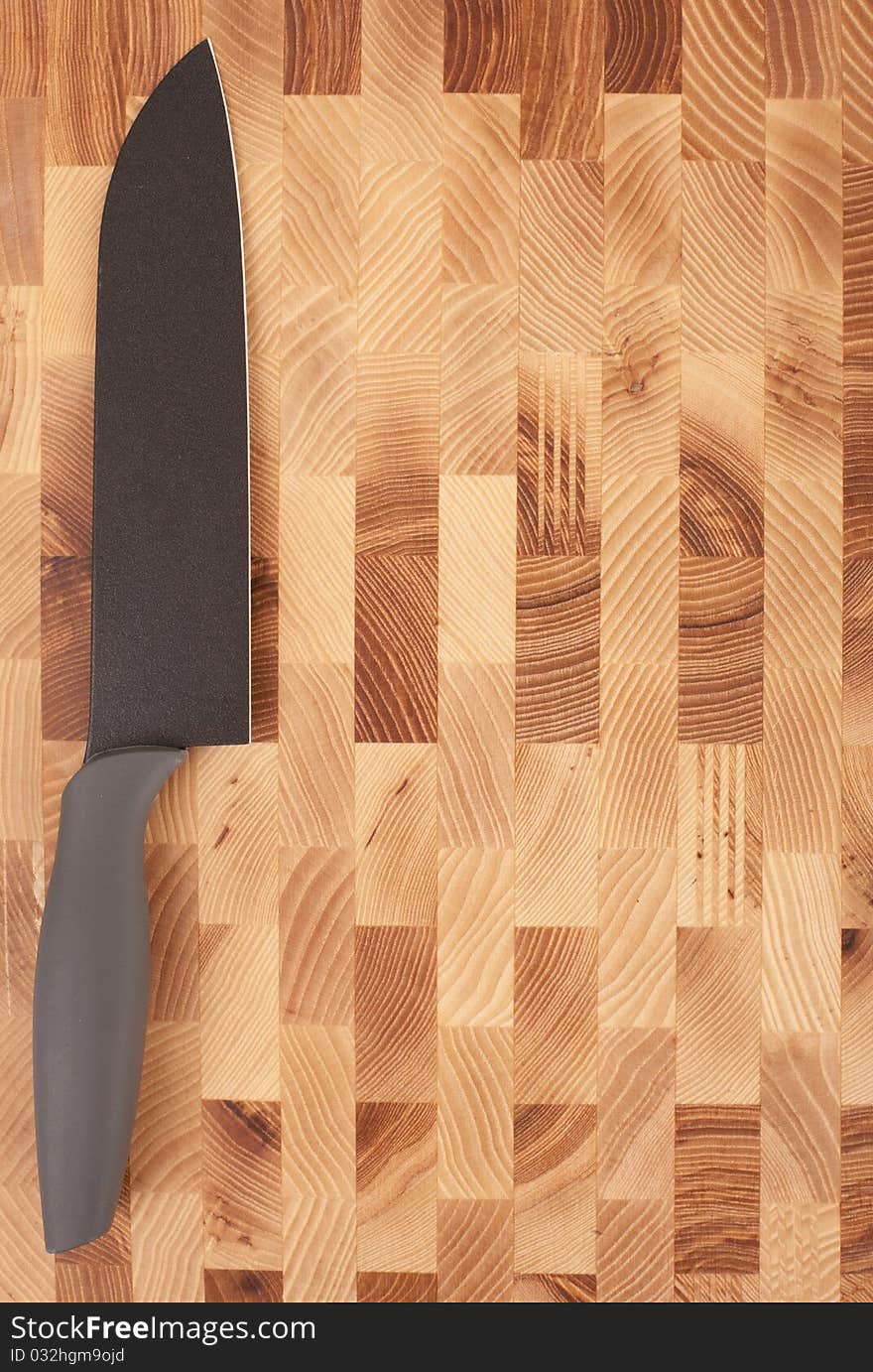 Kitchen knifes isolated on wooden background