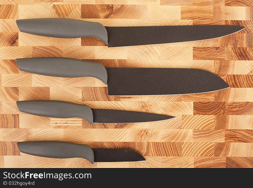 Kitchen Knifes Isolated On Wooden Background