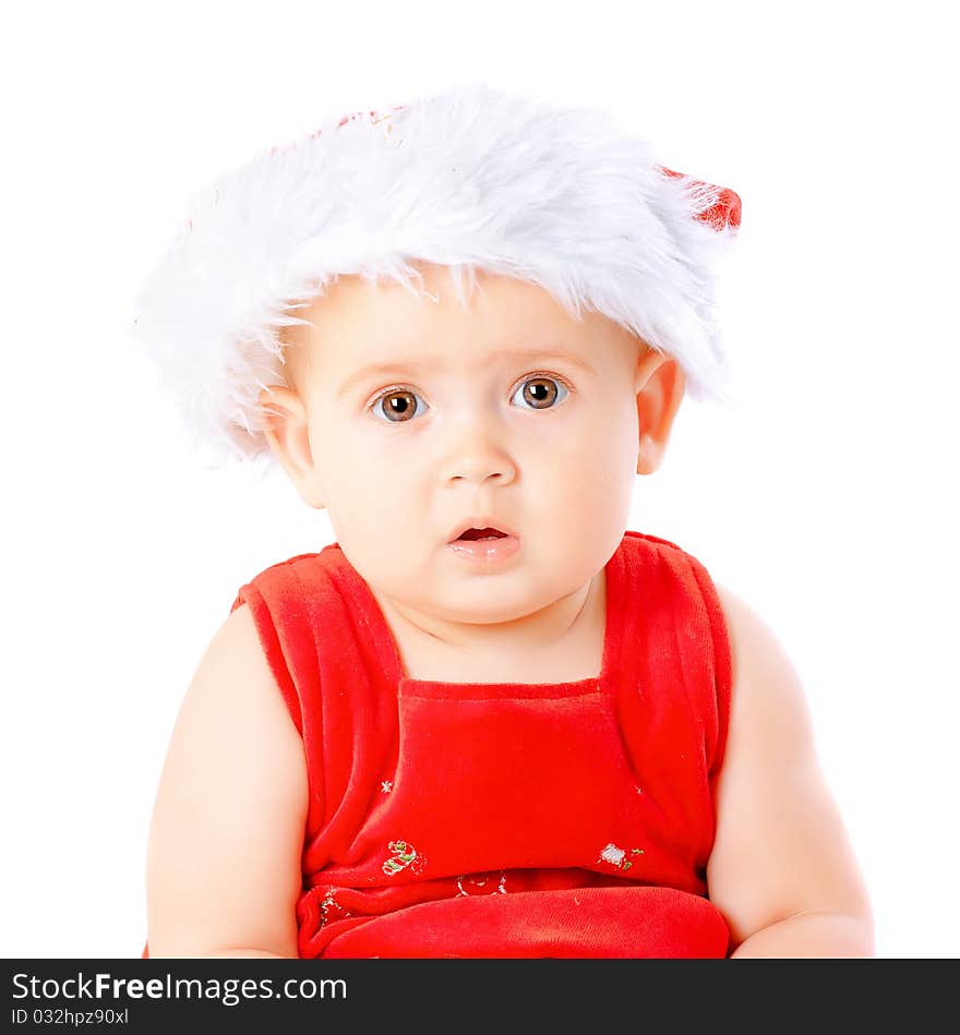 Baby in Santa Claus hat on white background