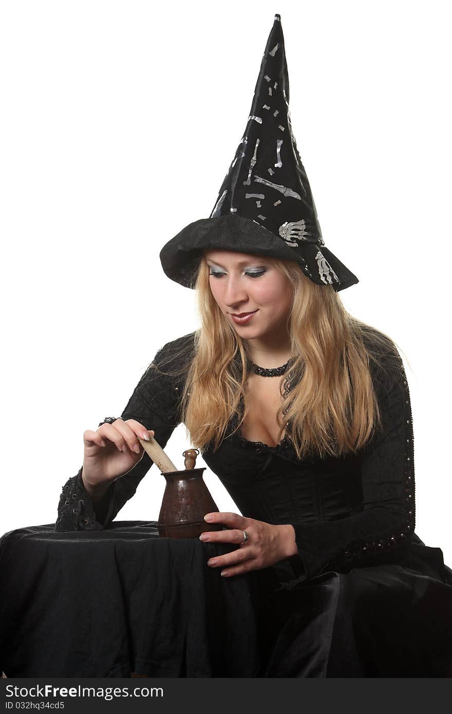 A young woman in a witch costume