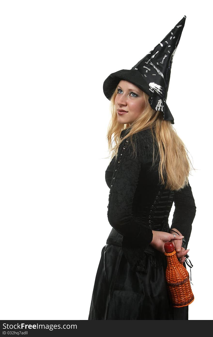 A young woman in a witch costume