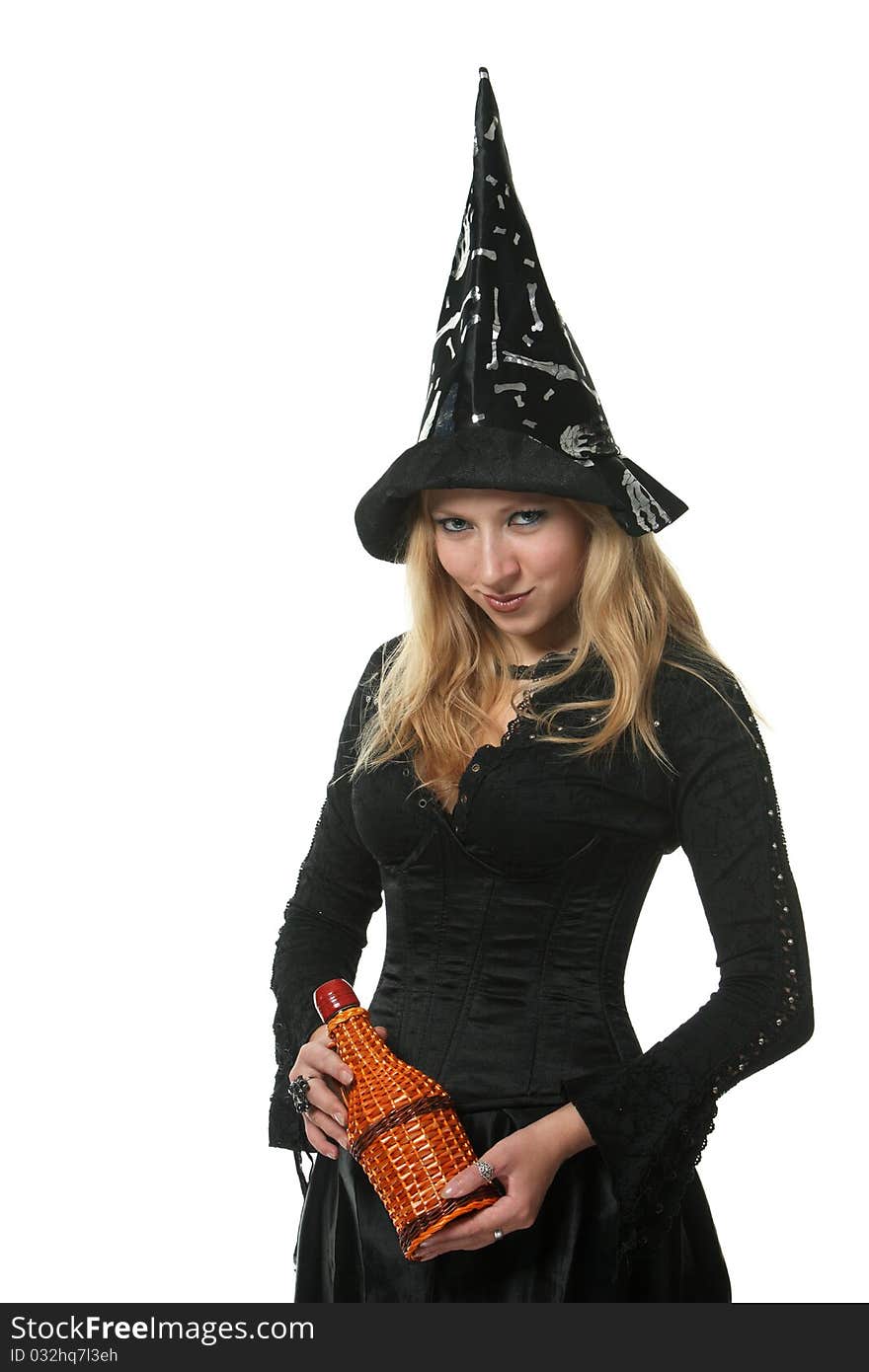 A young woman in a witch costume