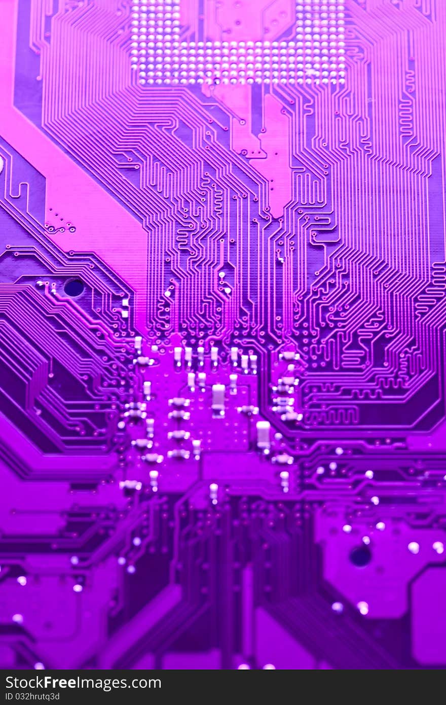 A close up shot of the backside of a computer circuit board, also known as a motherboard. A close up shot of the backside of a computer circuit board, also known as a motherboard