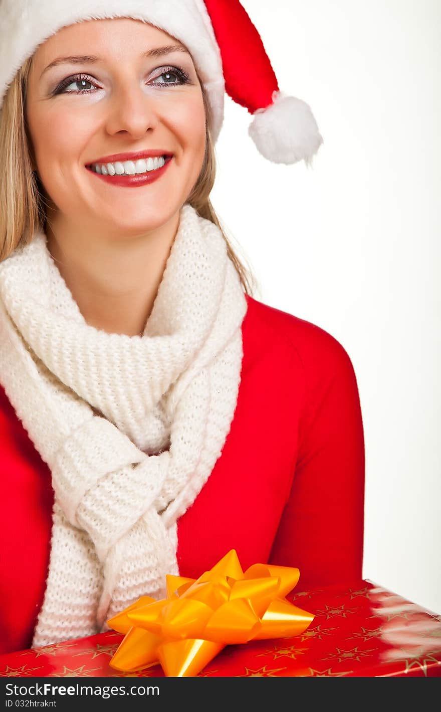 Woman in santa hat with christmas presents isolated on white background. Woman in santa hat with christmas presents isolated on white background