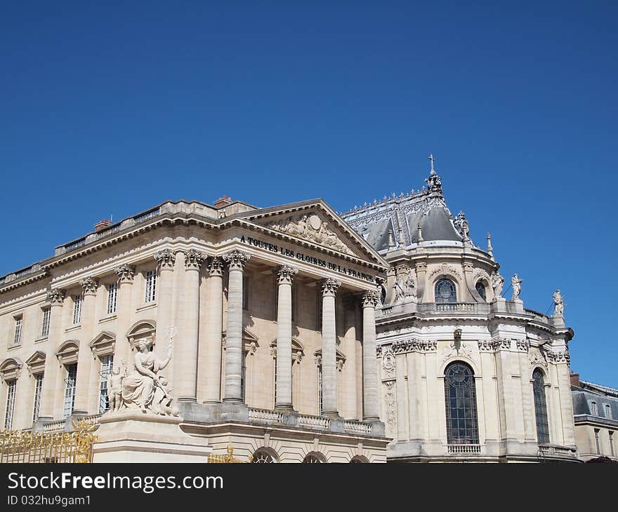 In front of Castle of Versaille frontage with blue sky in France Europe