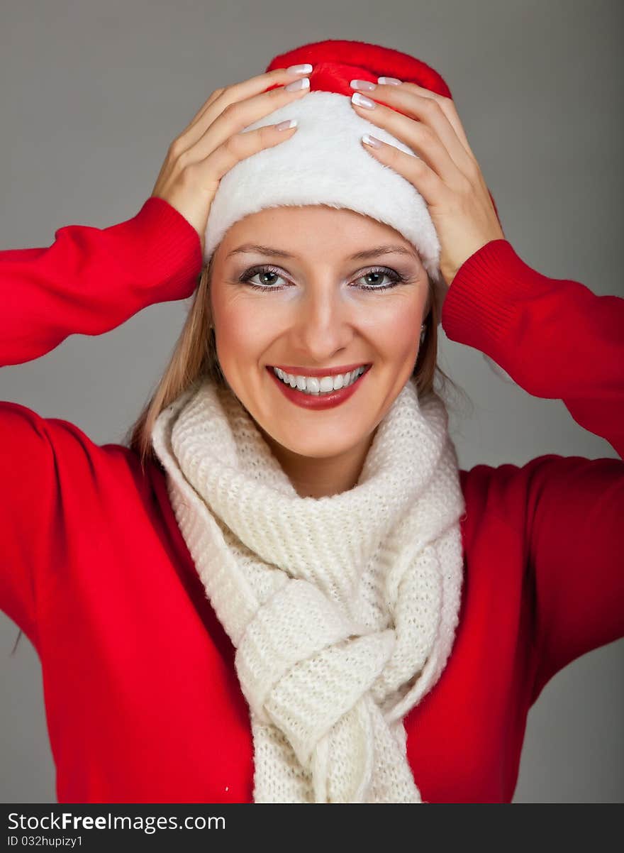 Woman in santa hat with presents