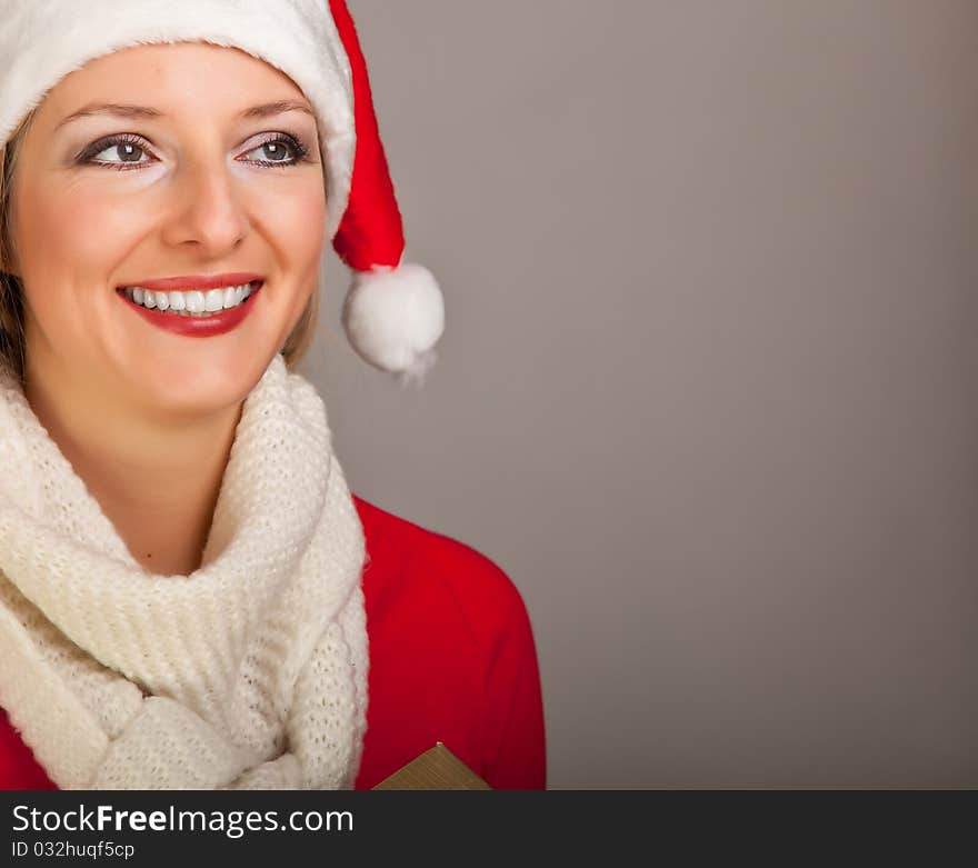 Woman in santa hat with christmas presents isolated on white background. Woman in santa hat with christmas presents isolated on white background