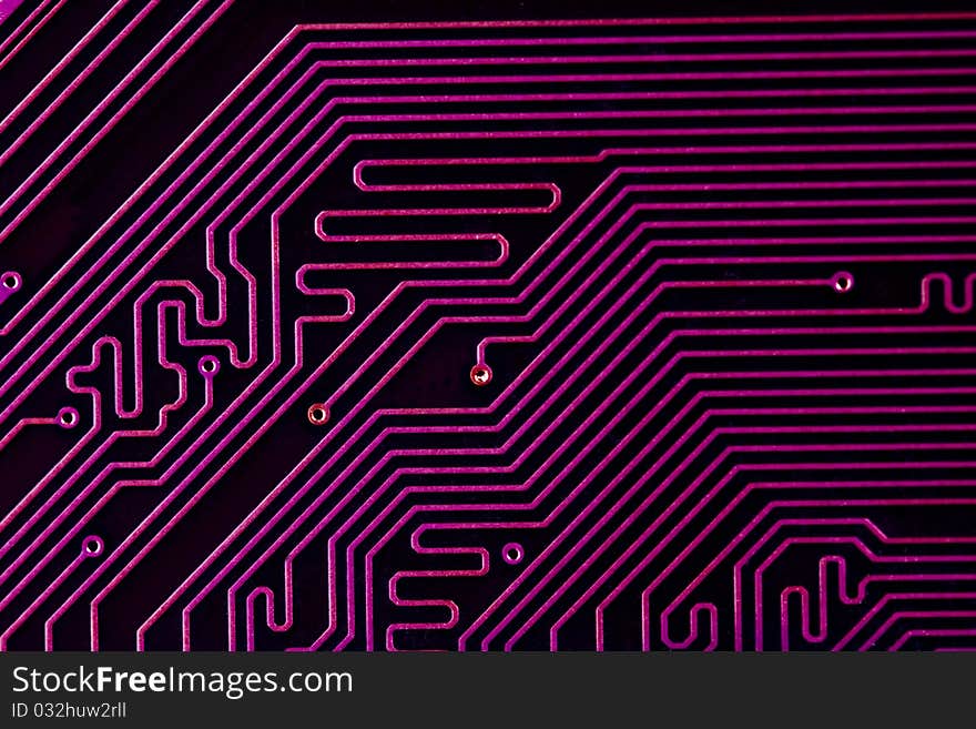 A close up shot of the backside of a computer circuit board, also known as a motherboard. A close up shot of the backside of a computer circuit board, also known as a motherboard