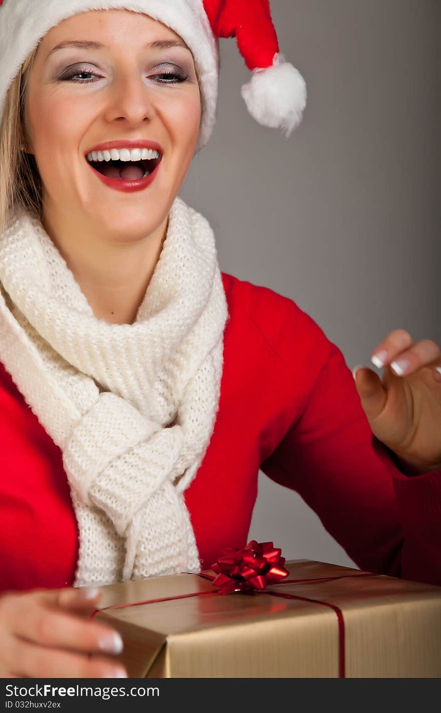 Woman In Santa Hat With Presents