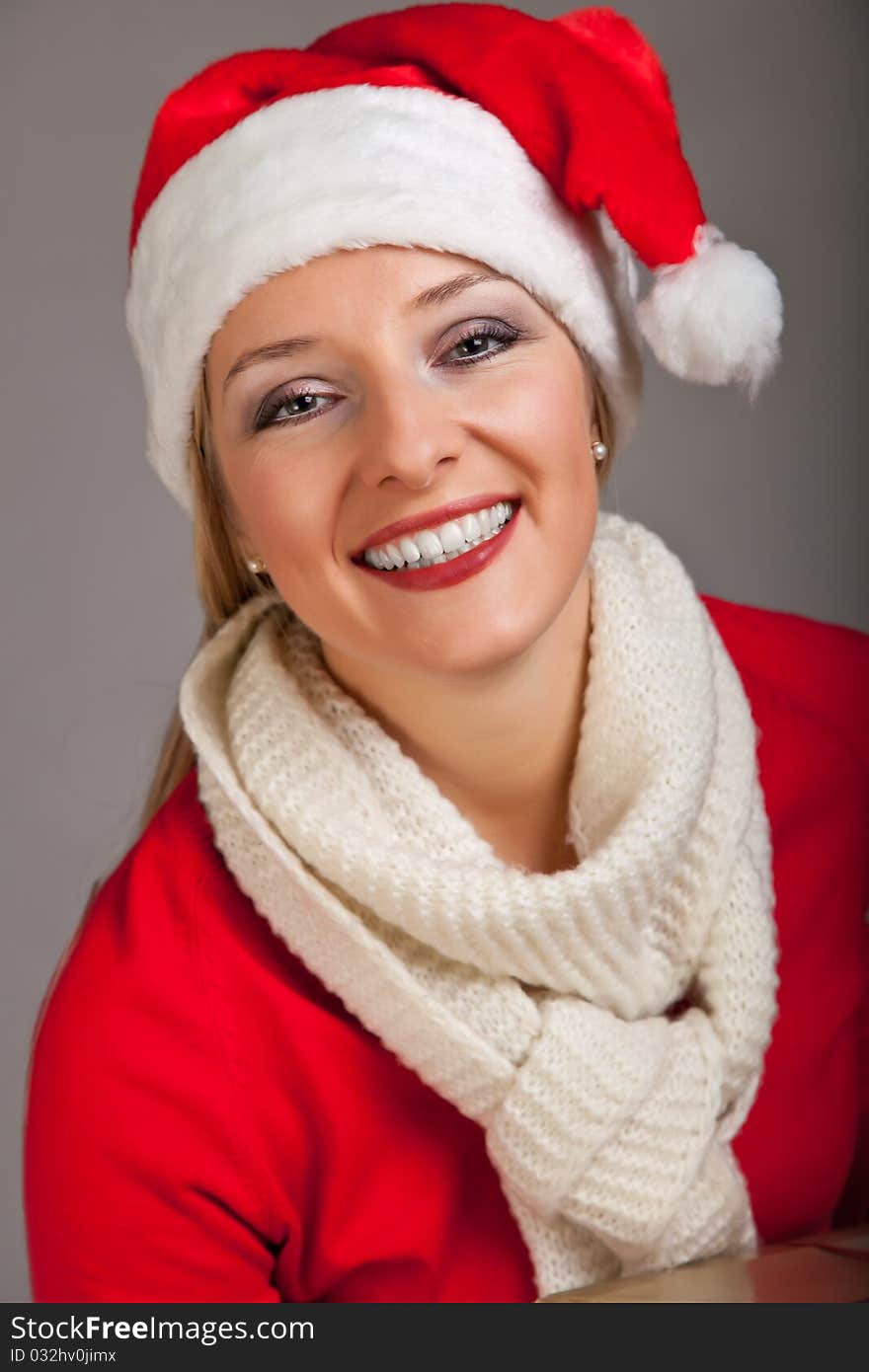 Woman in santa hat with presents