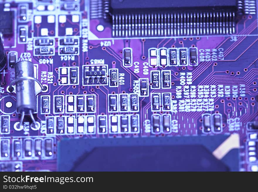 A close up shot of the backside of a computer circuit board. A close up shot of the backside of a computer circuit board.