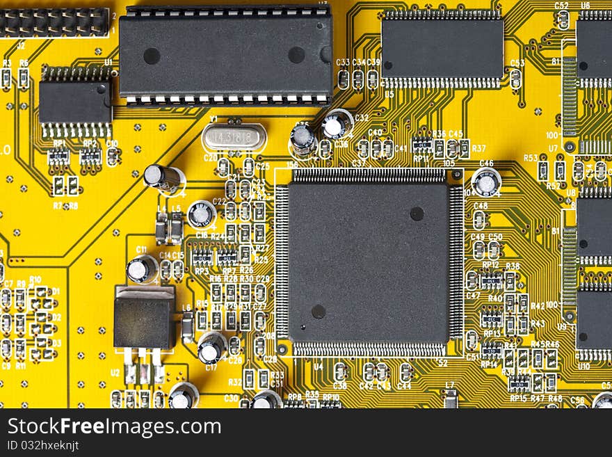 A close up shot of the backside of a computer circuit board. A close up shot of the backside of a computer circuit board.