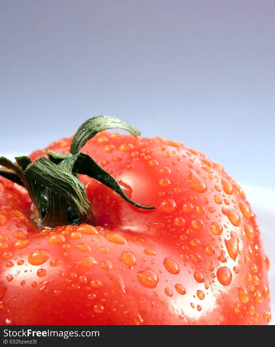 Juicy bright tomatoes on white plate. Juicy bright tomatoes on white plate