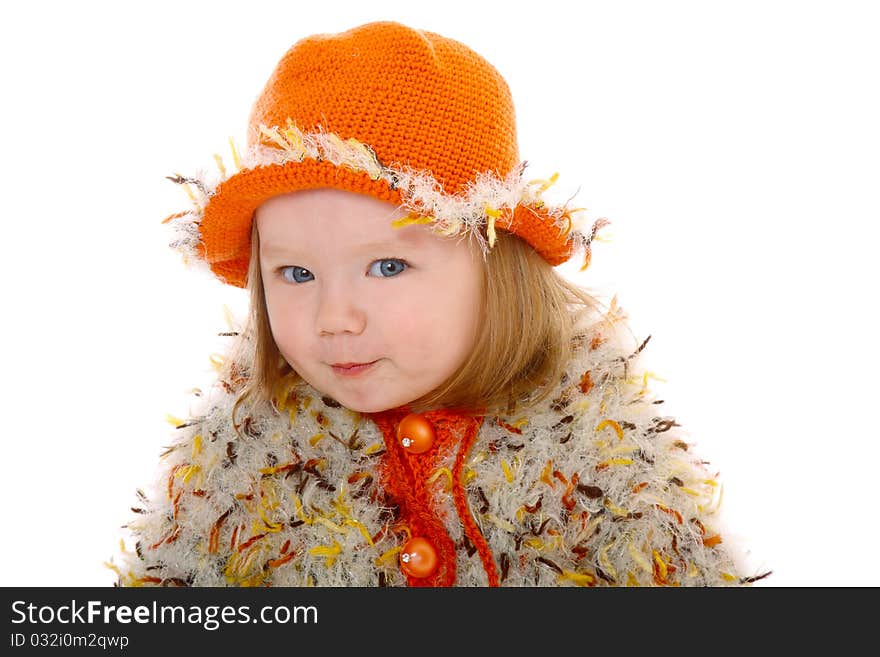 Little girl in orange hat smiling at camera  on white background. Little girl in orange hat smiling at camera  on white background