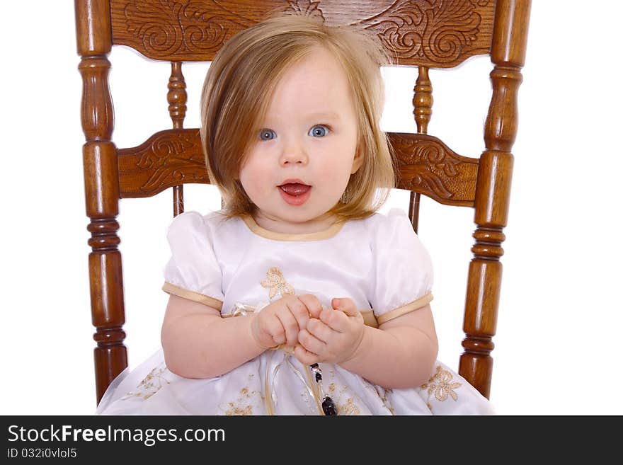 Adorable Baby Girl playing with beads isolated on white