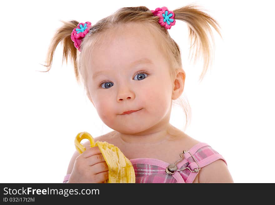Adorable and cute toddler eats banana, enjoying and posing. Adorable and cute toddler eats banana, enjoying and posing
