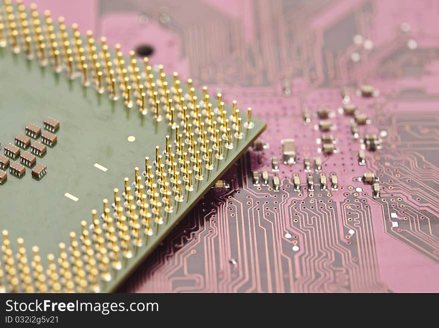 A close up shot of the backside of a computer circuit board. A close up shot of the backside of a computer circuit board.