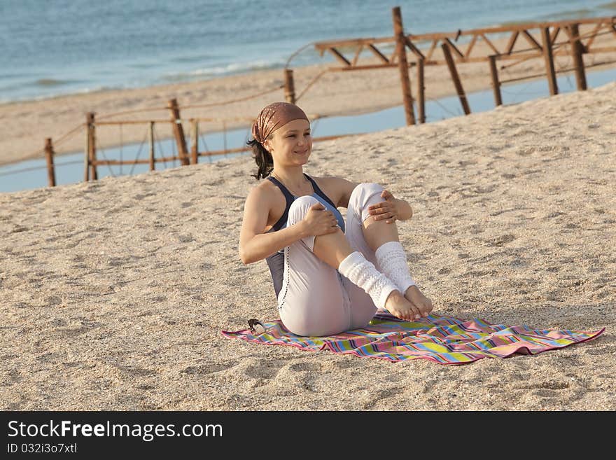 Young girl training on the beach