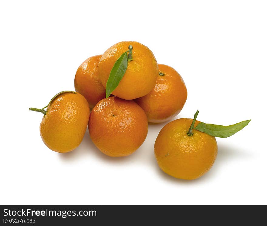 Mandarin with a leaf isolated on white background