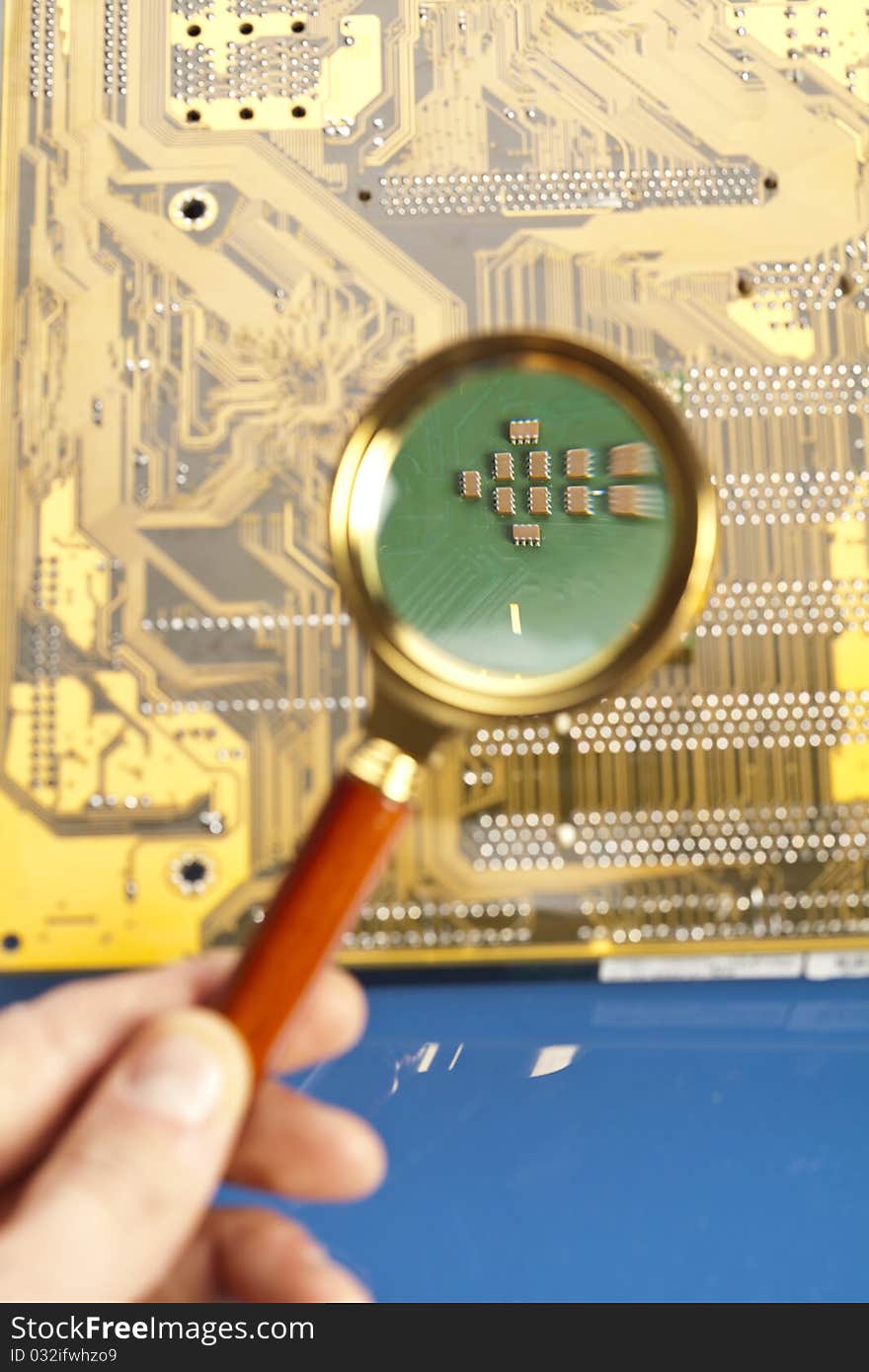 The approximation using a magnifying glass on the electronic path from the main computer base. The approximation using a magnifying glass on the electronic path from the main computer base