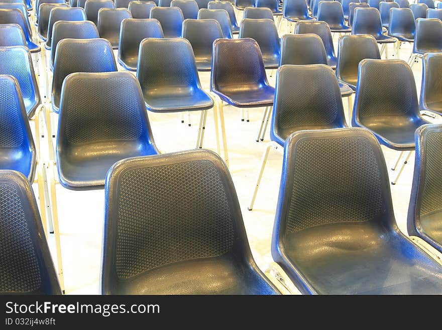 Black chairs in meeting room arranged for meeting